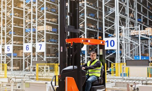 employee-working-on-forklift-in-modern-automatic-w-2023-11-27-05-31-14-utc-scaled.jpg